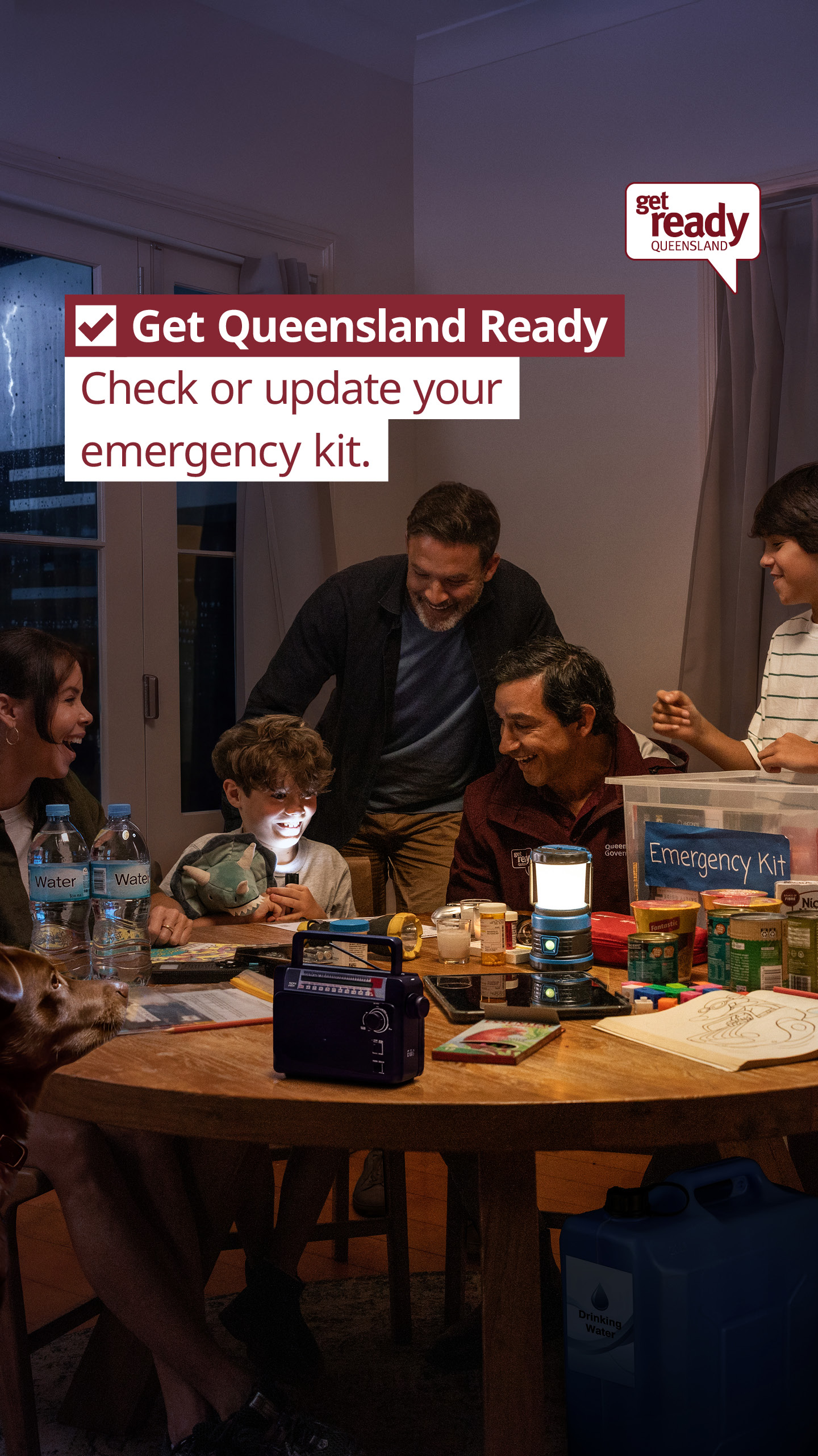 Get Ready Queensland promotional poster with family sitting around a table preparing their emergency kit with water, long life food, a radio and torches