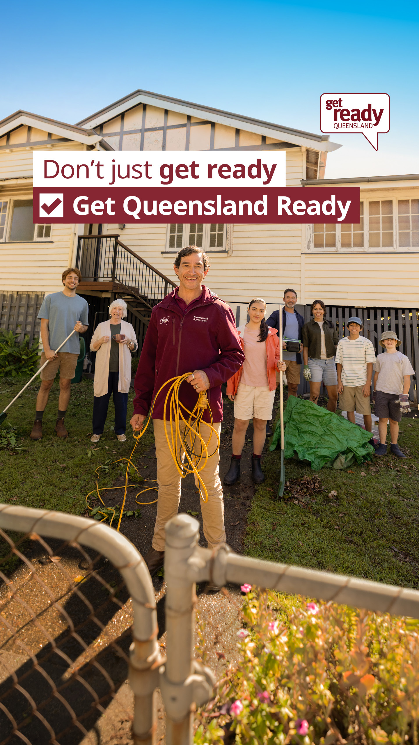 Get Ready Queensland promotional poster with family in garden in front of house carrying clear up tools and a severe weather emergency kit