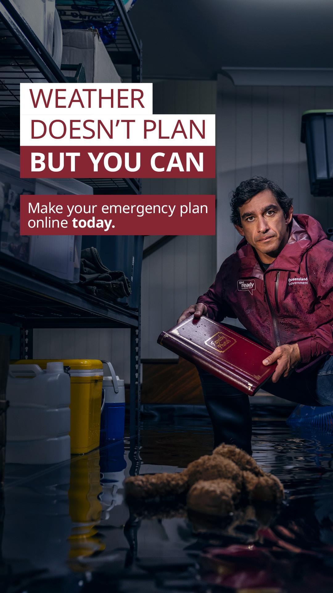 Man in flooded basement holding a web photo album