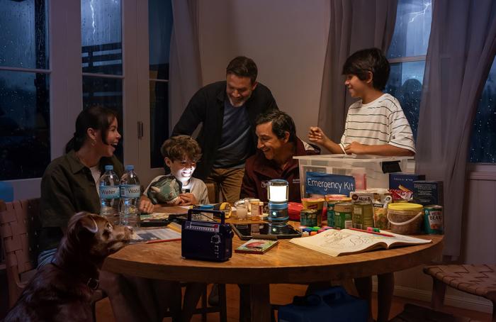 Queensland family looking through their emergency kit during a storm