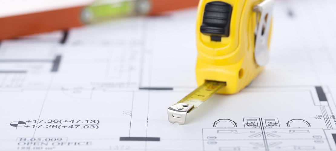 Tape measure and plans