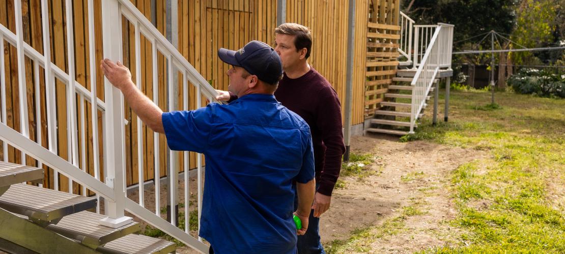 Homeowner talking to a builder