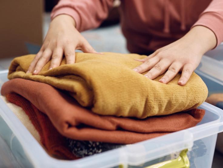 Person packing blankets