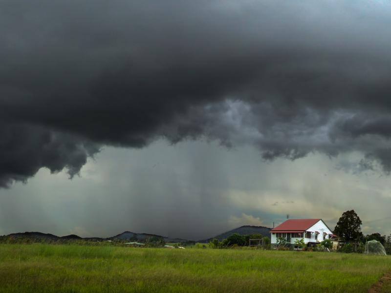 Farm house under stormy sky