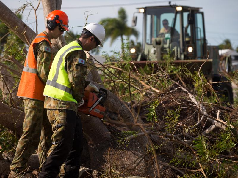 Workers clearing away debris