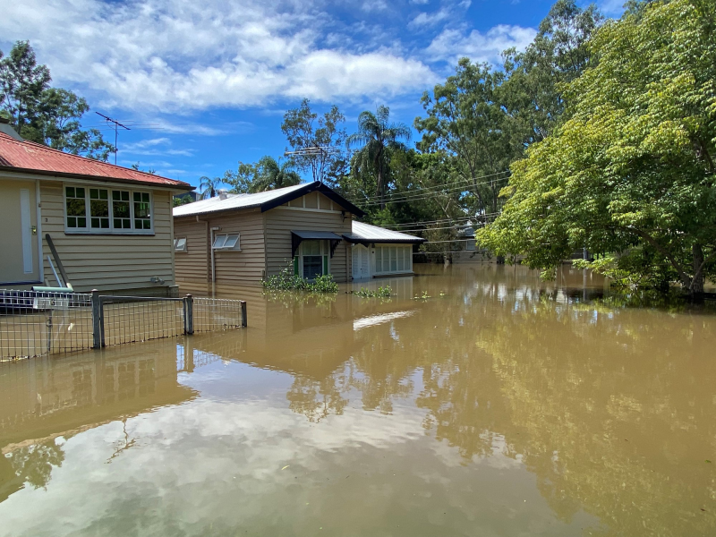House with flood water over flooring